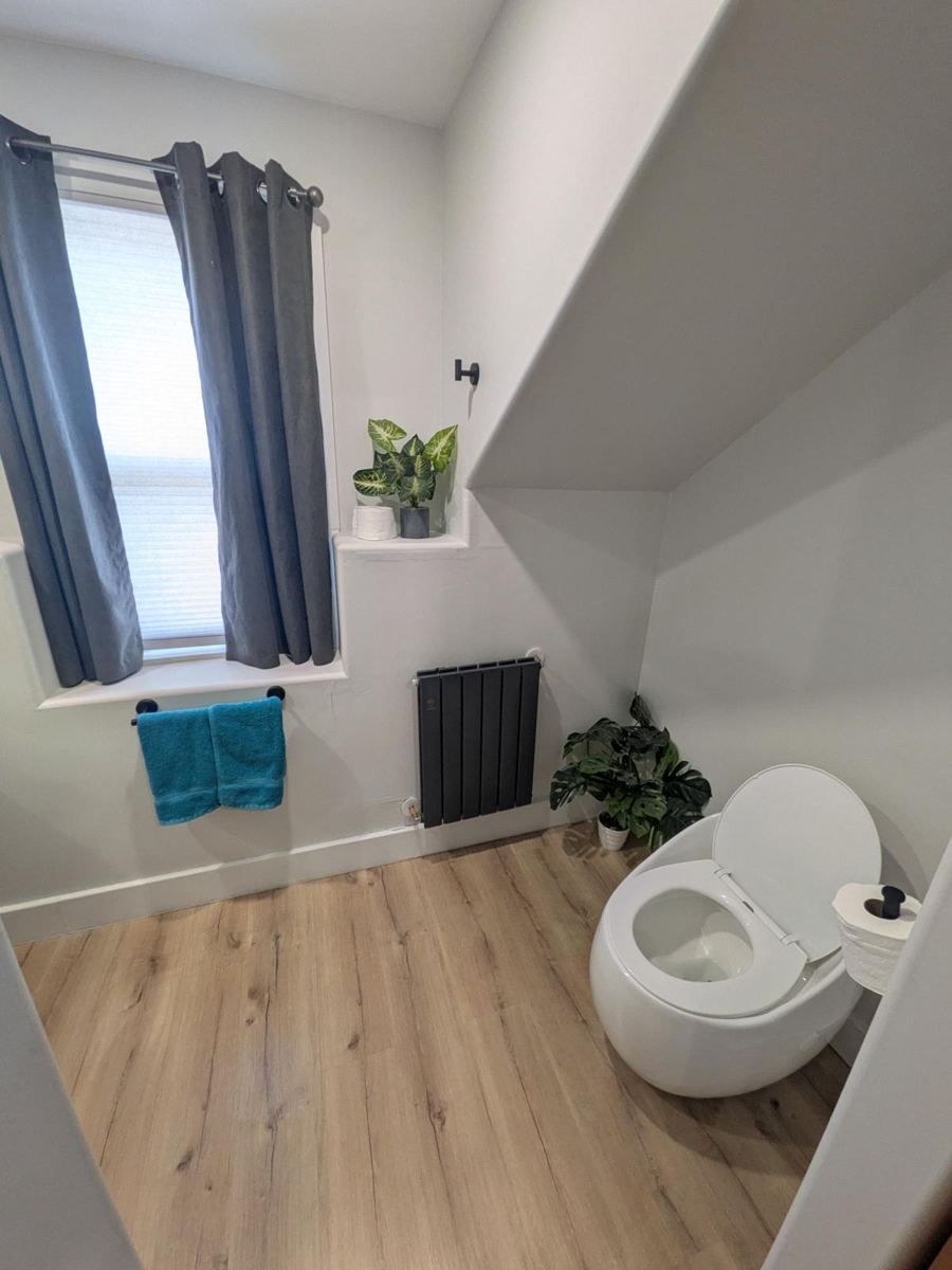 Bathroom with window and towel bar